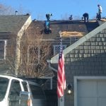 Complete roof tearoff including wood replacement.